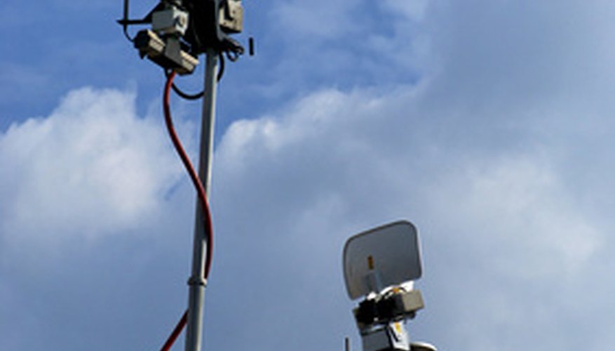Photo Credit: Television satellite camera antennas image by Stephen Orsillo from <a href='http://www.fotolia.com'>Fotolia.com</a> Radio and television are good communication tools for reaching a wide audience.