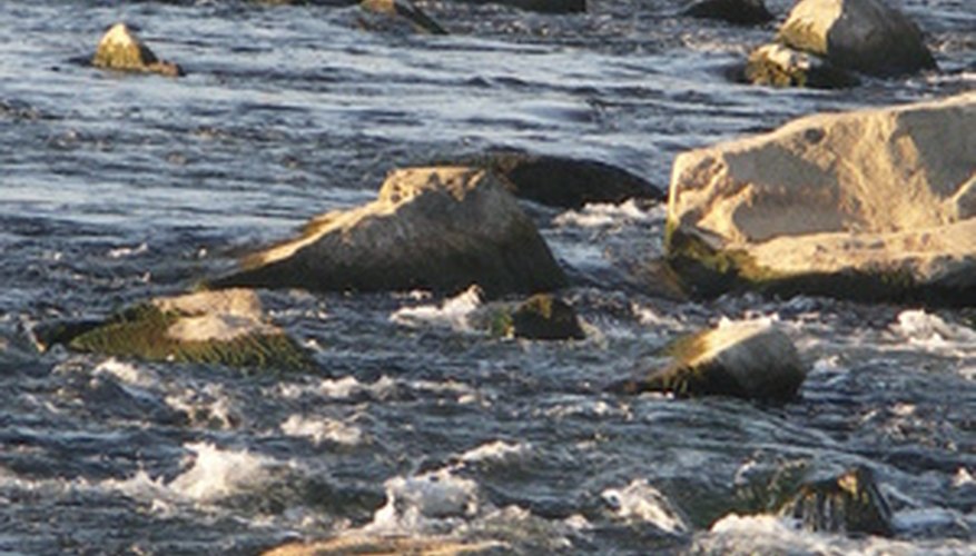 Photo Credit: river image by Bartek Jurkowski from <a href='http://www.fotolia.com'>Fotolia.com</a> Measuring topography means defining and assessing drainage systems.