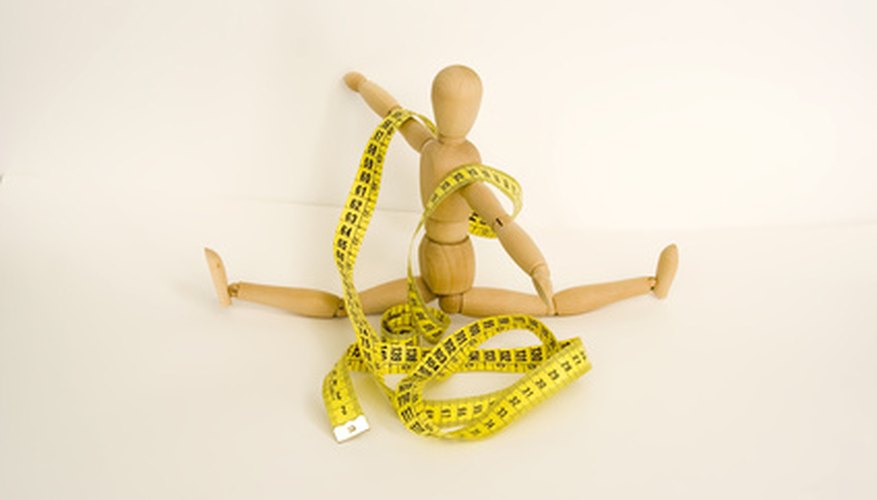 Photo Credit: wood person with yellow metric ribbon image by silviaantunes from <a href='http://www.fotolia.com'>Fotolia.com</a> The ladder method of metric conversion can help prevent you from making a mess.