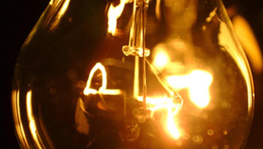 Photo Credit: light bulb image by circotasu from <a href='http://www.fotolia.com'>Fotolia.com</a> Electrical power depends on voltage and current.