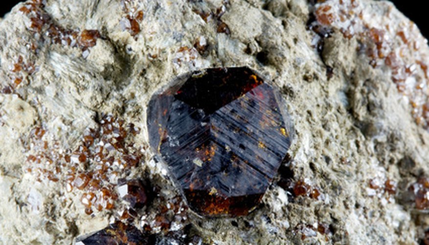 Photo Credit: crystal of garnet image by Alexander Maksimov from <a href='http://www.fotolia.com'>Fotolia.com</a> Garnet is the state mineral of Connecticut.