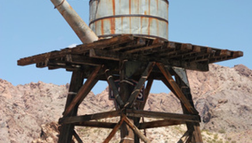 Photo Credit: old water tank image by MAXFX from <a href='http://www.fotolia.com'>Fotolia.com</a> Calculate the pressure at any point in the tank.