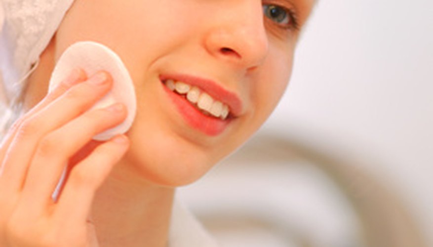 Photo Credit: woman in towel image by Nikolay Okhitin from <a href='http://www.fotolia.com'>Fotolia.com</a> A professionally applied facial is one of the joys of the spa party.