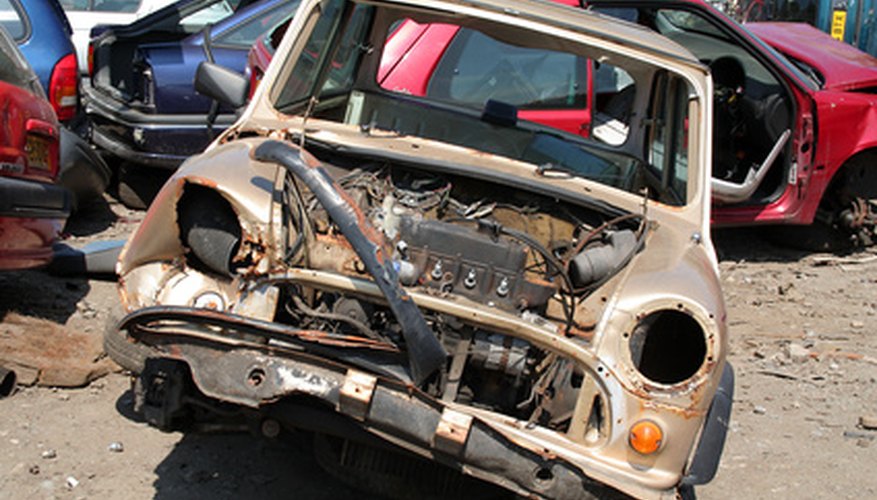 Photo Credit: scrap yard image by hazel proudlove from <a href='http://www.fotolia.com'>Fotolia.com</a> A salvage yard must be permitted on your property.