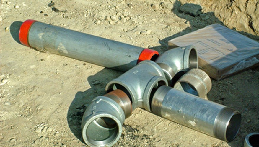 Photo Credit: plumbing fittings image by Greg Pickens from <a href='http://www.fotolia.com'>Fotolia.com</a> A handyman will require additional licensing if he chooses to work as a plumbing contractor.
