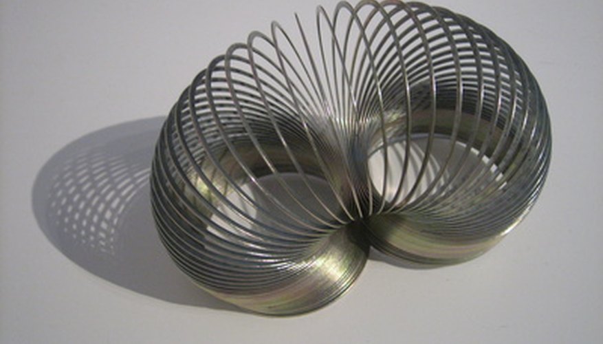 The tendency for a slinky to return to its natural shape makes it good for tricks. The tendency for a slinky to return to its natural shape makes it good for tricks.