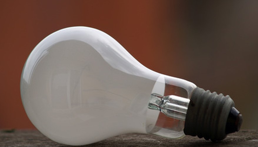 Photo Credit: bulb image by AGITA LEIMANE from <a href='http://www.fotolia.com'>Fotolia.com</a> A light bulb emits lumes based on its wattage.