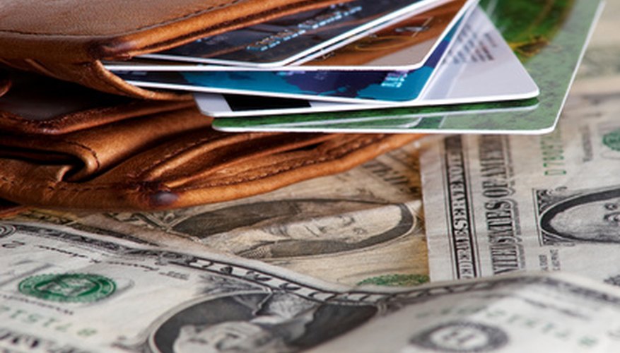 Photo Credit: Purse image by Mykola Velychko from <a href='http://www.fotolia.com'>Fotolia.com</a> International Debt an investment tool to diversify a portfolio.