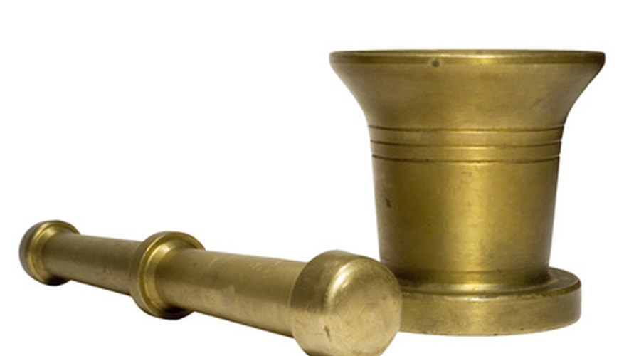 Photo Credit: mortar image by Aleksandr Ugorenkov from <a href='http://www.fotolia.com'>Fotolia.com</a> Mortar and pestle