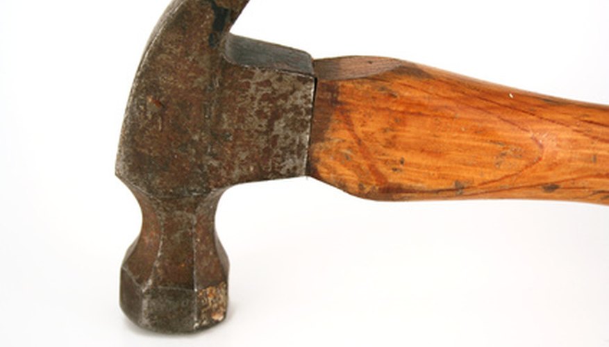 Photo Credit: the hammer image by Jim Mills from <a href='http://www.fotolia.com'>Fotolia.com</a> Use safety precautions when working with a hammer.