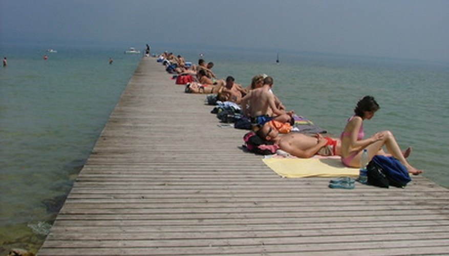 Photo Credit: hot day on the pier image by Ben Bolton from <a href='http://www.fotolia.com'>Fotolia.com</a> High relative humidity in the summer can translate to muggy conditions.
