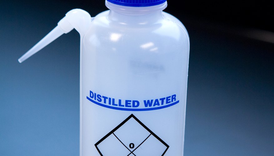 Photo Credit: Jupiterimages/Photos.com/Getty Images Distillation can separate pure water from contaminants.