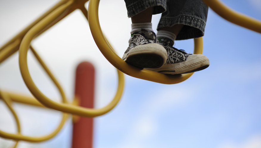 Child climbing on bars Child climbing on bars