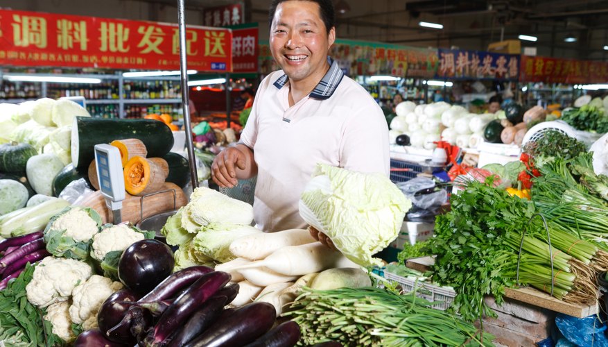 Farmer selling vegetables in food market
