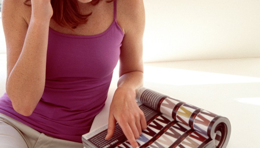 Woman on cell phone with magazine