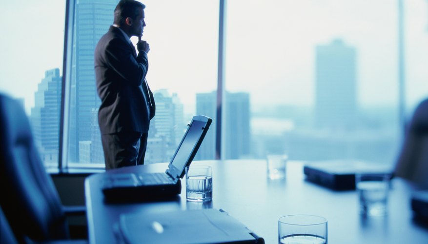 Businessman standing alone in a conference room