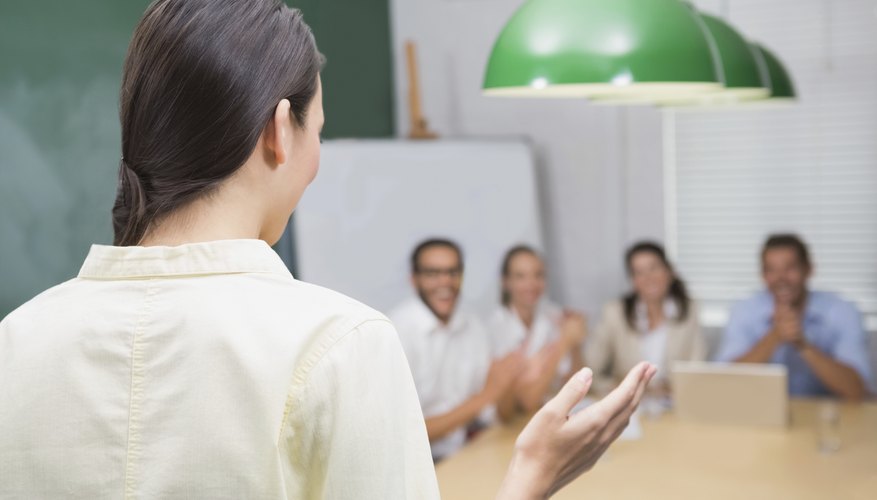 Smiling businesswoman giving presentation to her colleagues