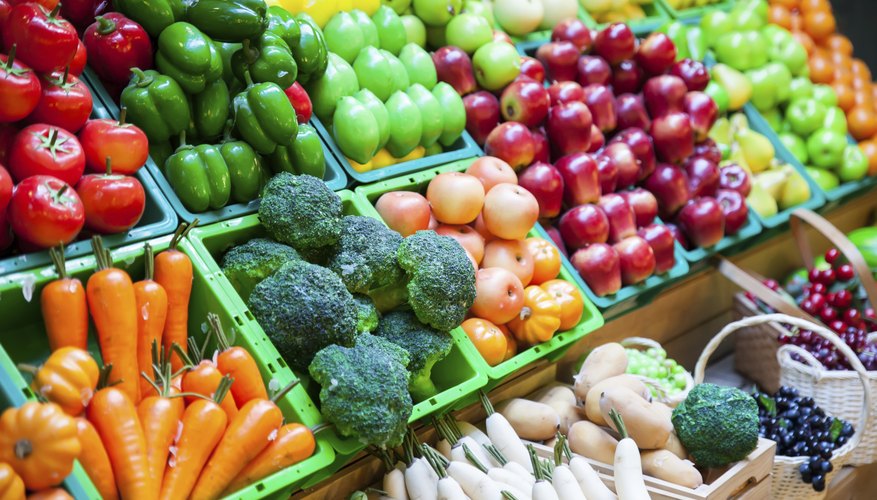 Fruits and vegetables for sale at a market. Fruits and vegetables for sale at a market.