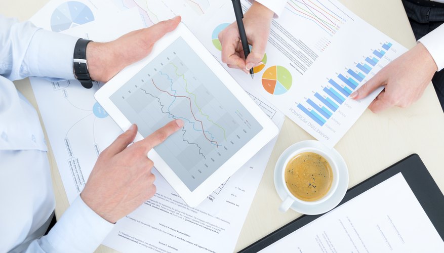 Photo Credit: pressureUA/iStock/Getty Images Analyzing markets and economy.