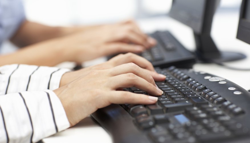 Close up of businesswomen typing