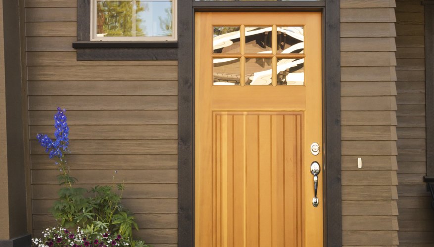 A rustic wood front door on a modern home. A rustic wood front door on a modern home.