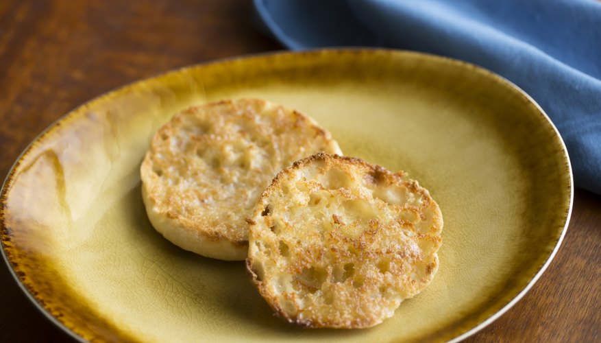 A toasted English muffin on a plate. A toasted English muffin on a plate.