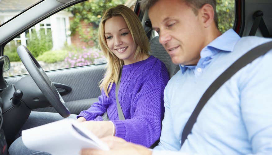 Teenage Girl Having Driving Lesson With Instructor