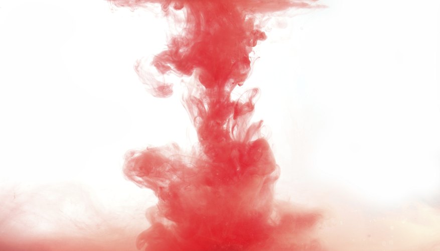 Photo Credit: AlekZotoff/iStock/Getty Images Red ink dropped into water.