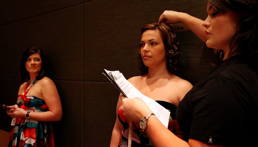 Two plus-size teen model contestants at a competition. Two plus-size teen model contestants at a competition.