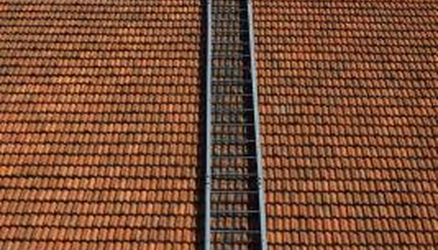 Photo Credit: Hemera Technologies/AbleStock.com/Getty Images Materials are among the factors affecting the cost of a roof.