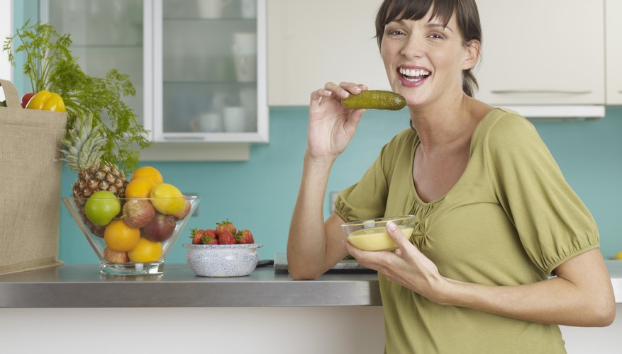 pregnant woman eating a pickle pregnant woman eating a pickle
