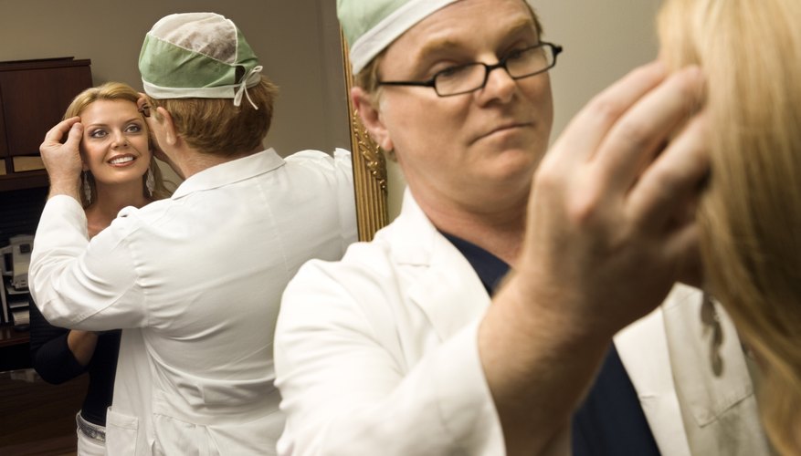 Doctor inspecting face of patient Doctor inspecting face of patient