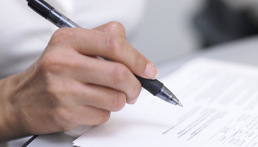 Businessperson holding pen