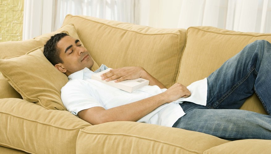 man sleeping on couch man sleeping on couch