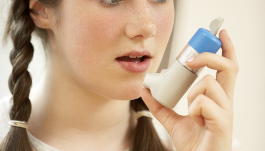 Child with asthma inhaler Child with asthma inhaler