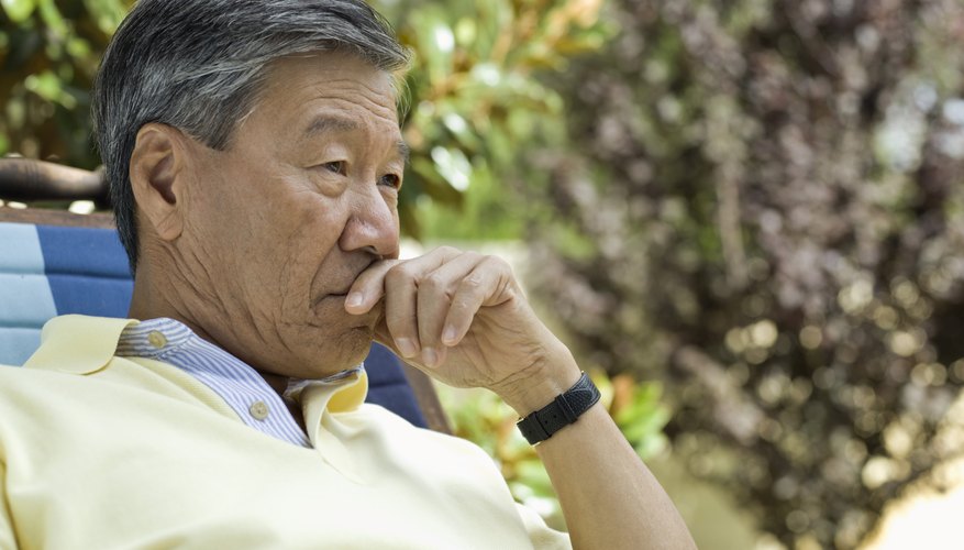 Senior man resting outdoors Senior man resting outdoors