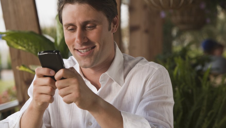 Young adult male using his smart phone