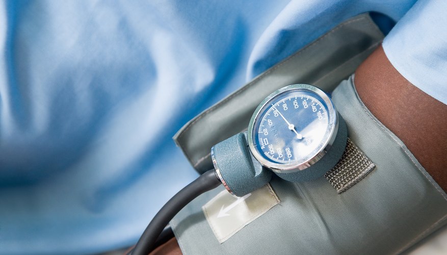Man taking blood pressure Man taking blood pressure