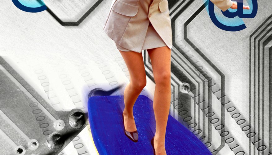 Businesswoman surfing on circuit board (Digital Composite)