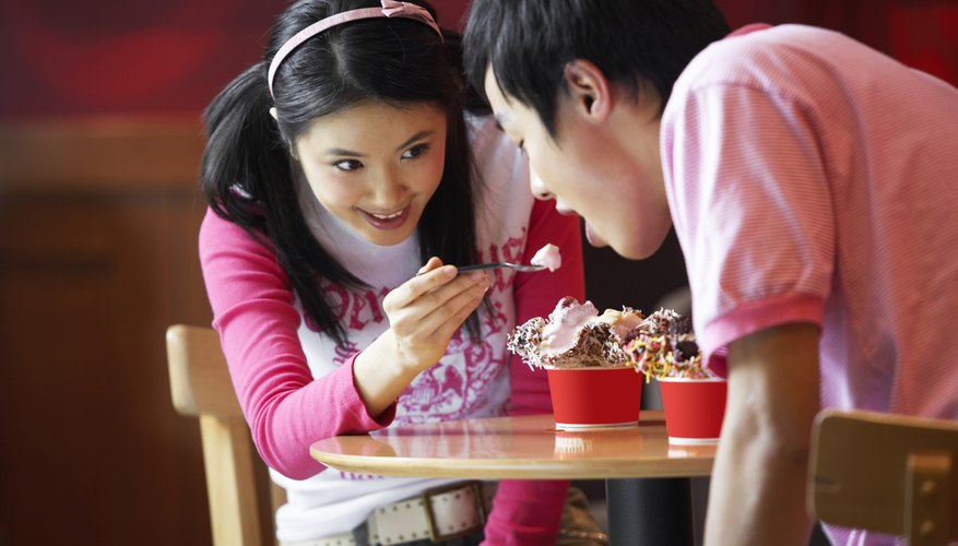 Young kids are eating ice cream. Young kids are eating ice cream.