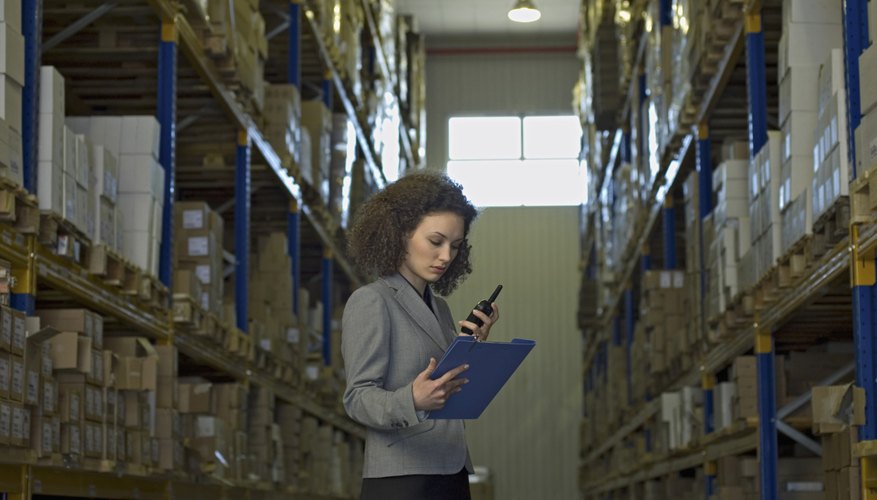 Businesswoman standing in warehouse