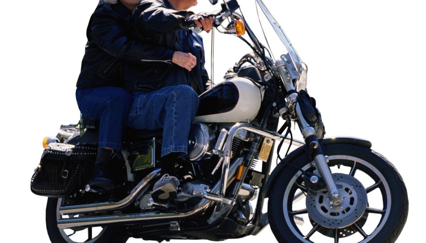 Senior couple riding motorcycle