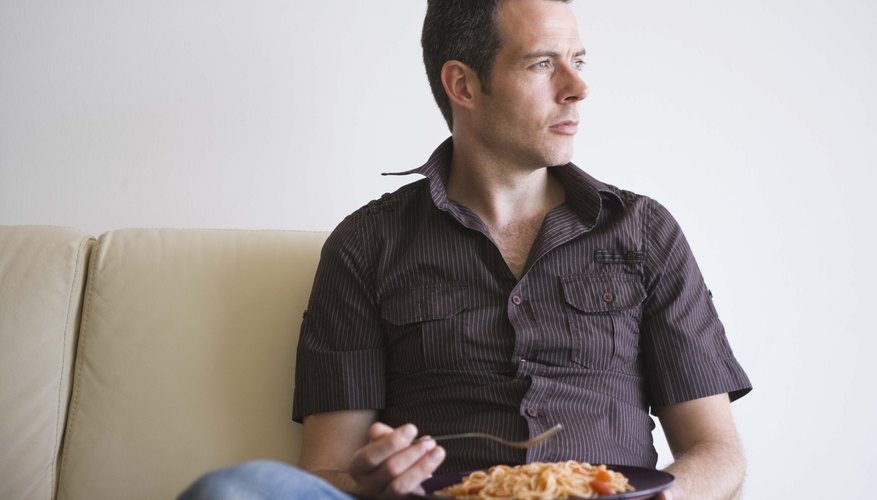 Man eating pasta Man eating pasta