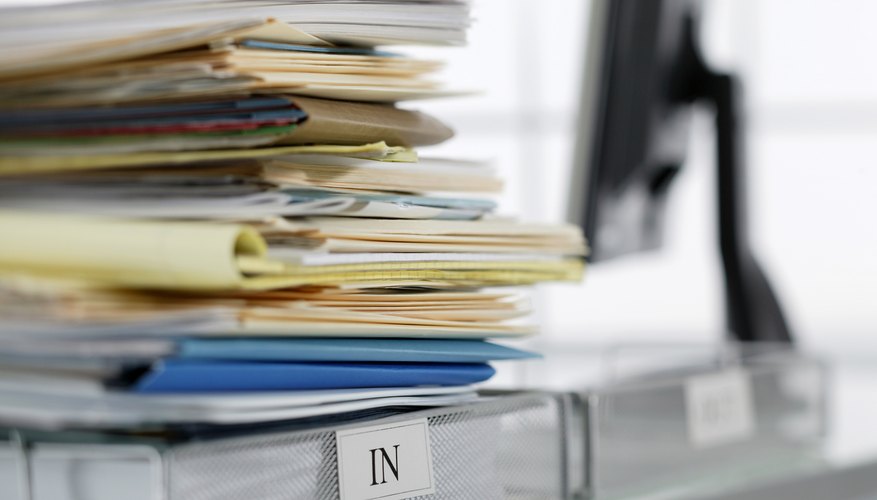 Photo Credit: Comstock Images/Comstock/Getty Images Files piled up