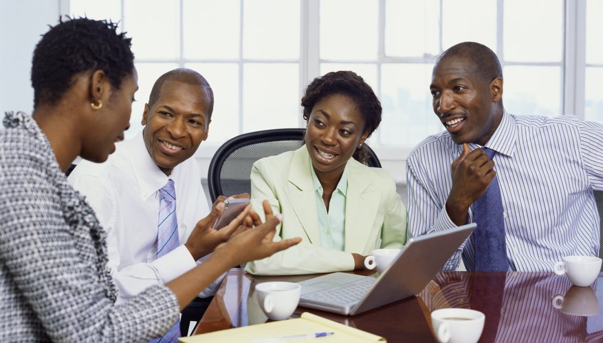 Photo Credit: Stockbyte/Stockbyte/Getty Images Men and women working together.