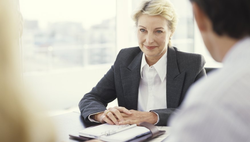 Photo Credit: George Doyle/Stockbyte/Getty Images Woman conducting interview