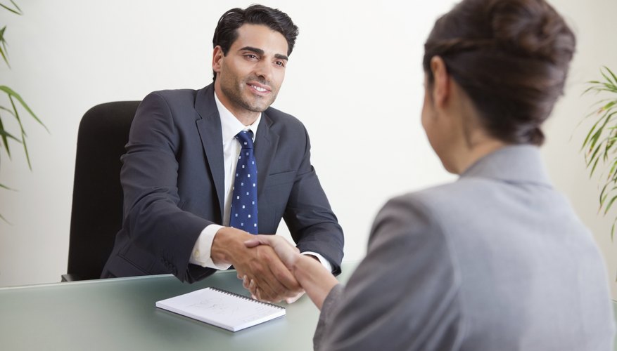 Smiling manager interviewing a female applicant