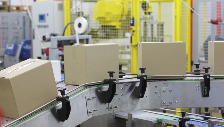 automation - Cardboard boxes on conveyor belt in factory