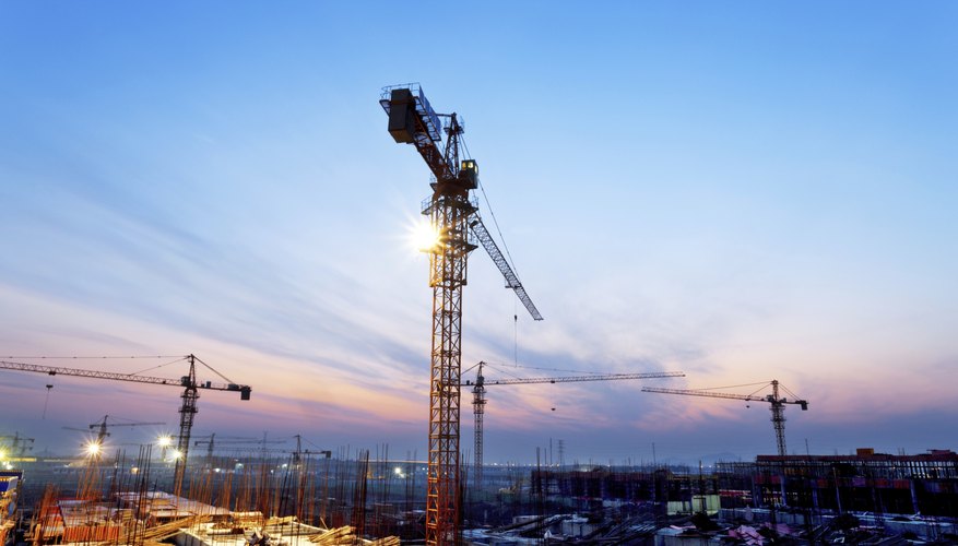 Photo Credit: zhudifeng/iStock/Getty Images Wide shot of construction cranes