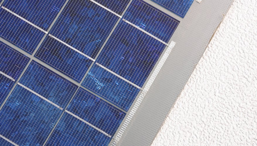 Photo Credit: Jupiterimages/Photos.com/Getty Images A solar panel's output declines slowly with time.